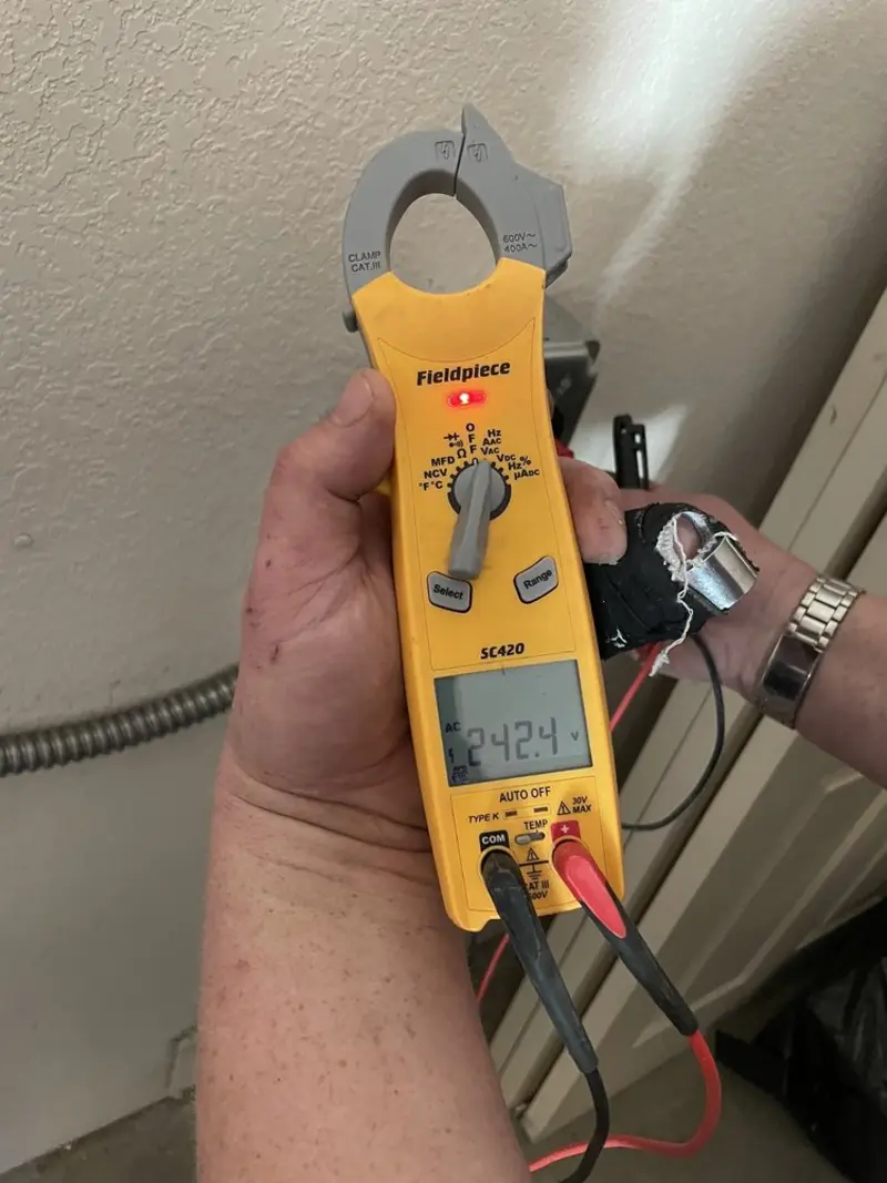 Voltage testing with clamp meter during Whole House Surge Protector in Cave Creek